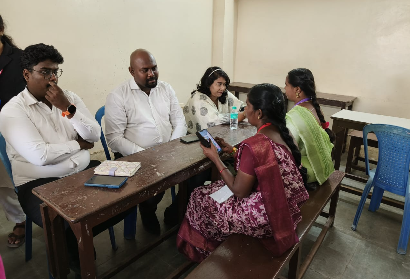 Team members listening to a participant during a one-on-one legal awareness discussion